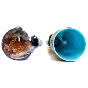 Side-by-side comparison of a heavily corroded pipe and the same pipe after Nu Flow lining, showing a smooth, blue interior surface restored using cured-in-place pipe technology.